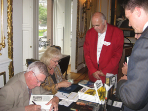 James I. Robertson Jr., Alumni Distinguished Professor (left), signs books at a chapter event.