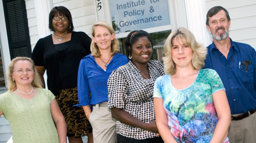 From left, Karen Boone, fiscal technician; Karen Mealy, vocational specialist; Mary Beth Dunkenberger, program director; and vocational specialists Michelline Stokes, Teena Vernon, and David Marshall, all with the Institute for Policy and Governance's Partnership for Self-Sufficiency, are helping New River Valley residents overcome barriers to employment. 