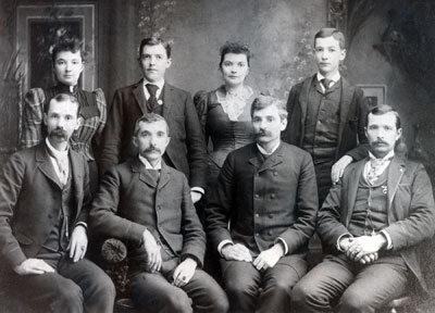 The adult Add Caldwell, second from left, front row, with seven of his eight siblings. Sitting beside him are Mic, to the left, and Frank, to the right, both of whom attended VAMC but did not graduate. Photo courtesy of the late William Addison "Bill" Caldwell, nephew and namesake of Virginia Tech's first student.