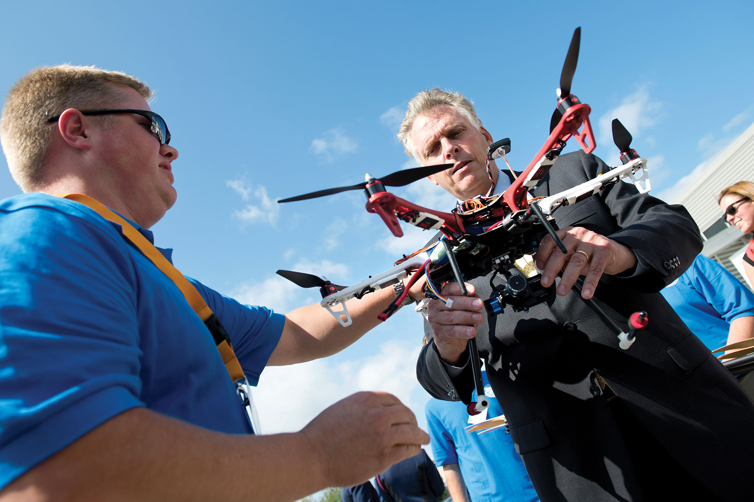 McAuliffe closely examines a drone