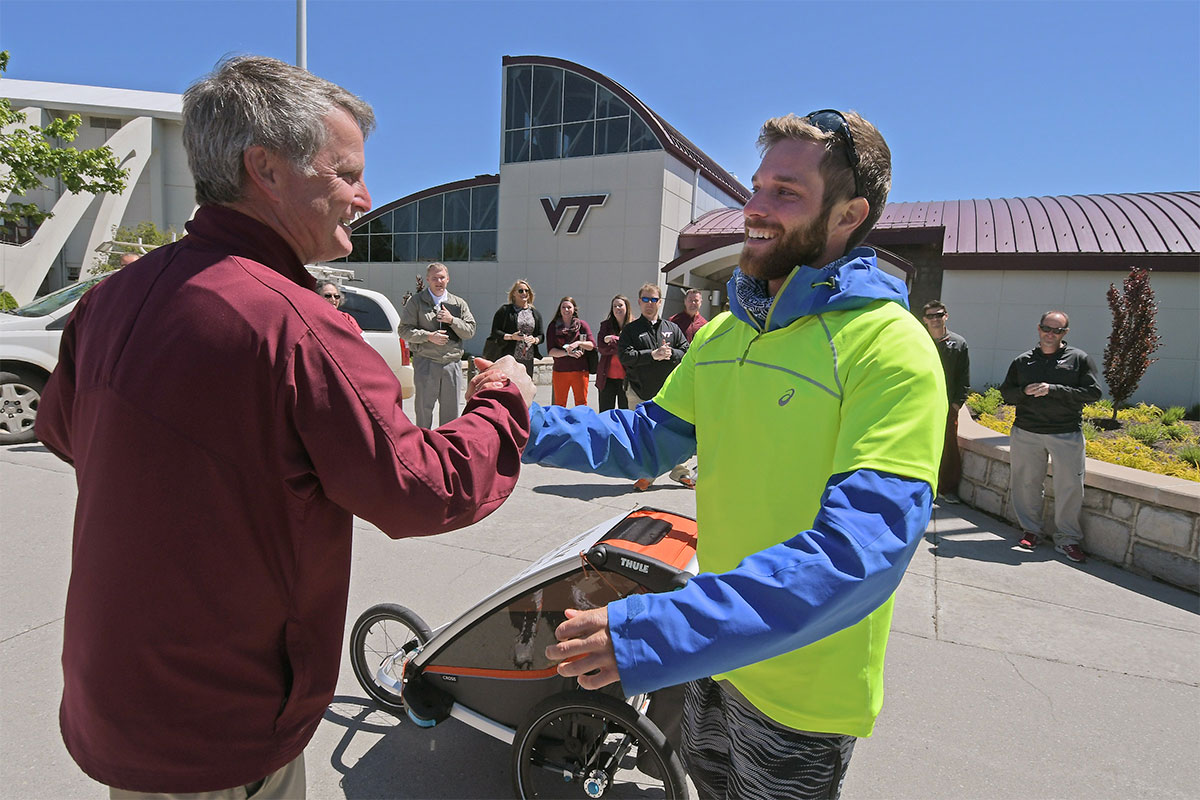 Sebestien Jacques '11 walking through Blacksburg