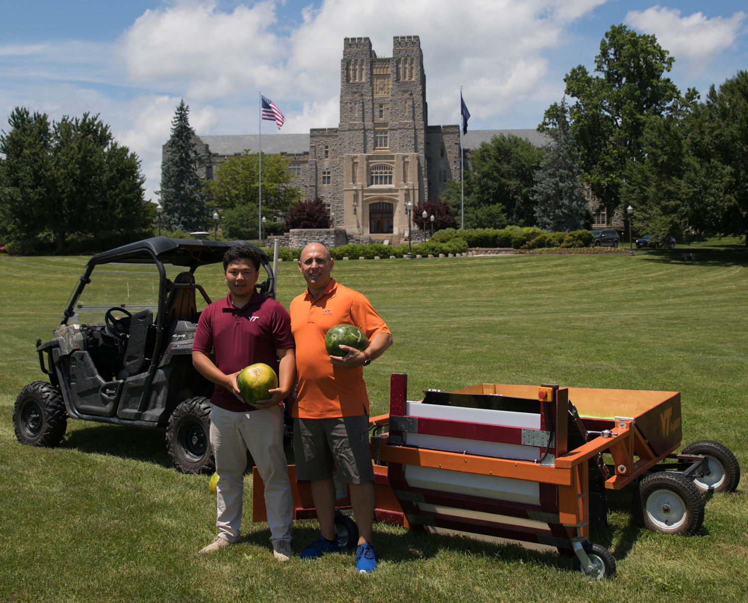 Hongxu Guo (left) and Alex Leonessa with the autonomous watermelon harvester.