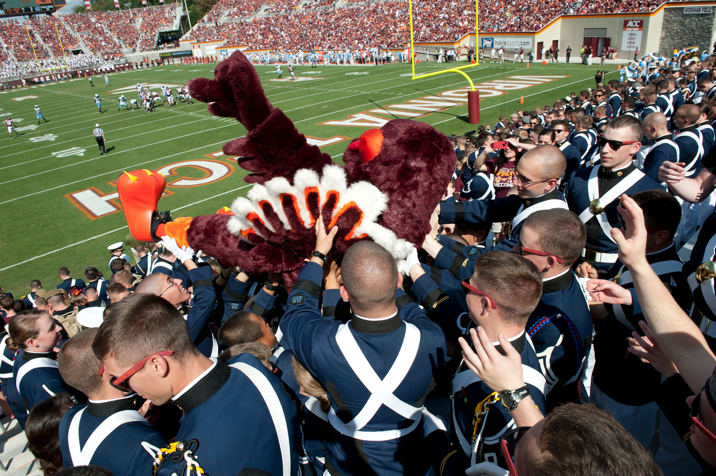 The Hokie bird crowd surfs up the Corps of Cadets student section during the Homecoming game against North Carolina.