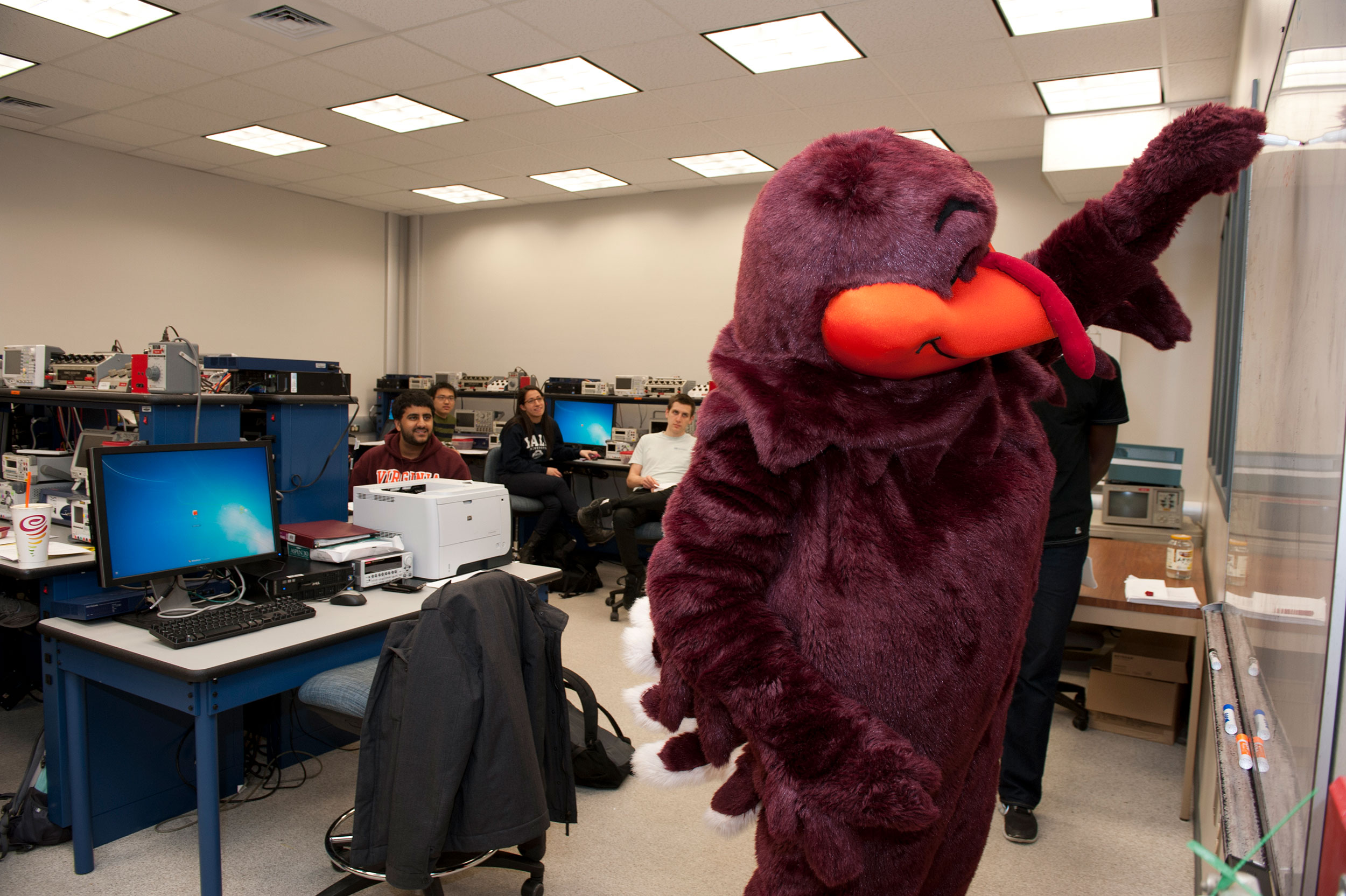 The Hokie Bird visits with students in the Electrical and Computer Engineering labs in Whittemore.