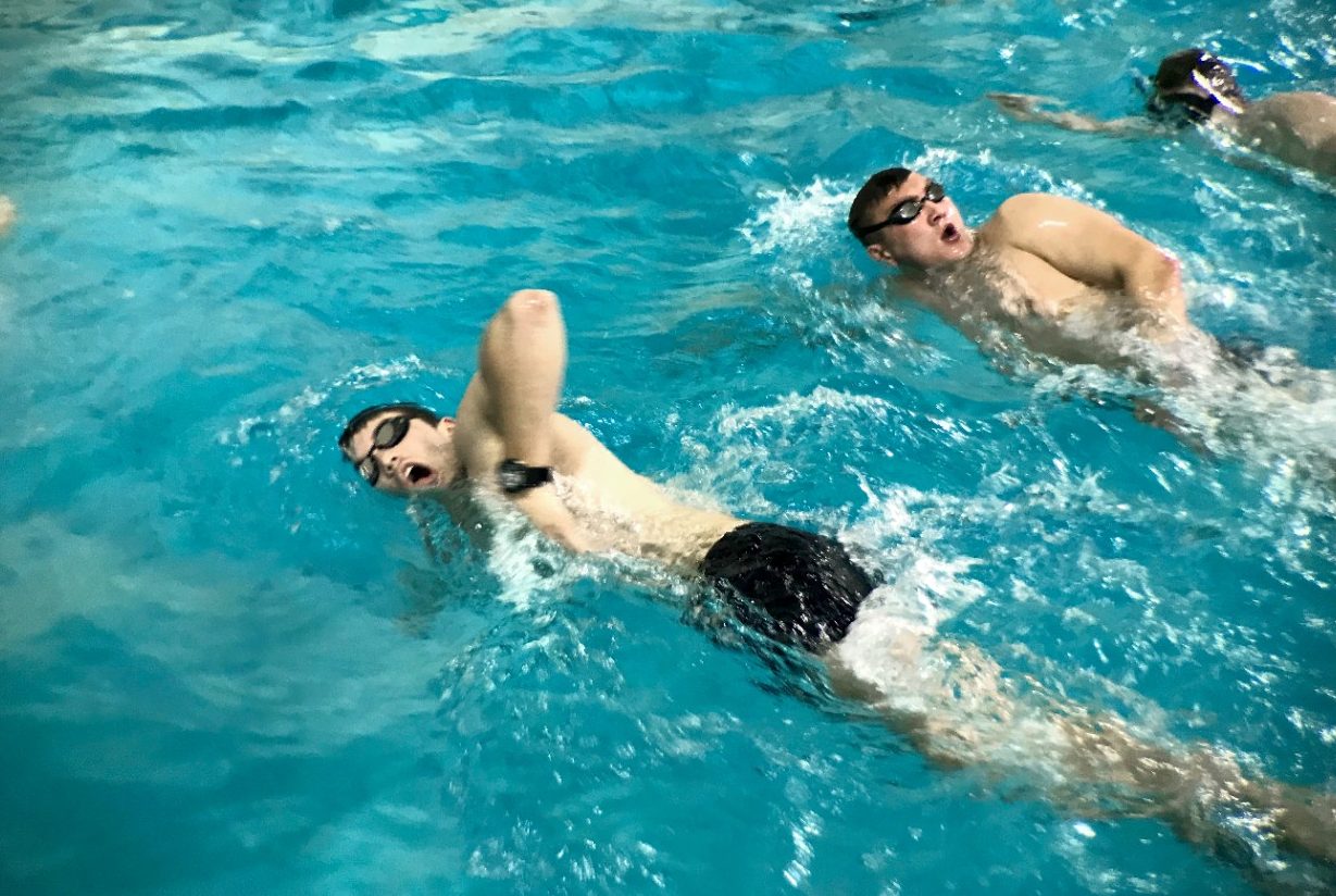 Cadets in the Naval Special Preparatory Team train in the War Memorial pool before dawn during the school year.