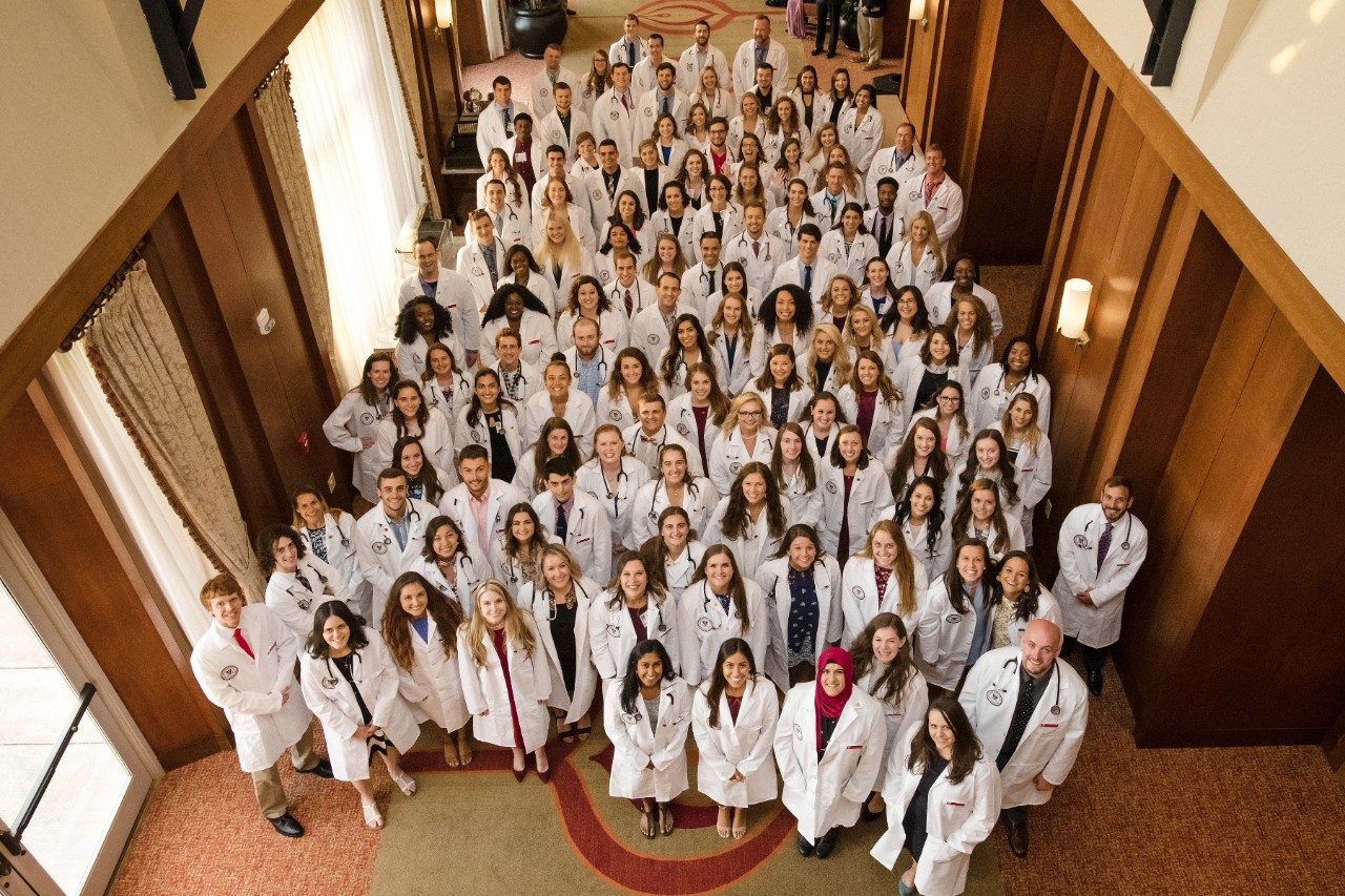 vet students white coat group shot