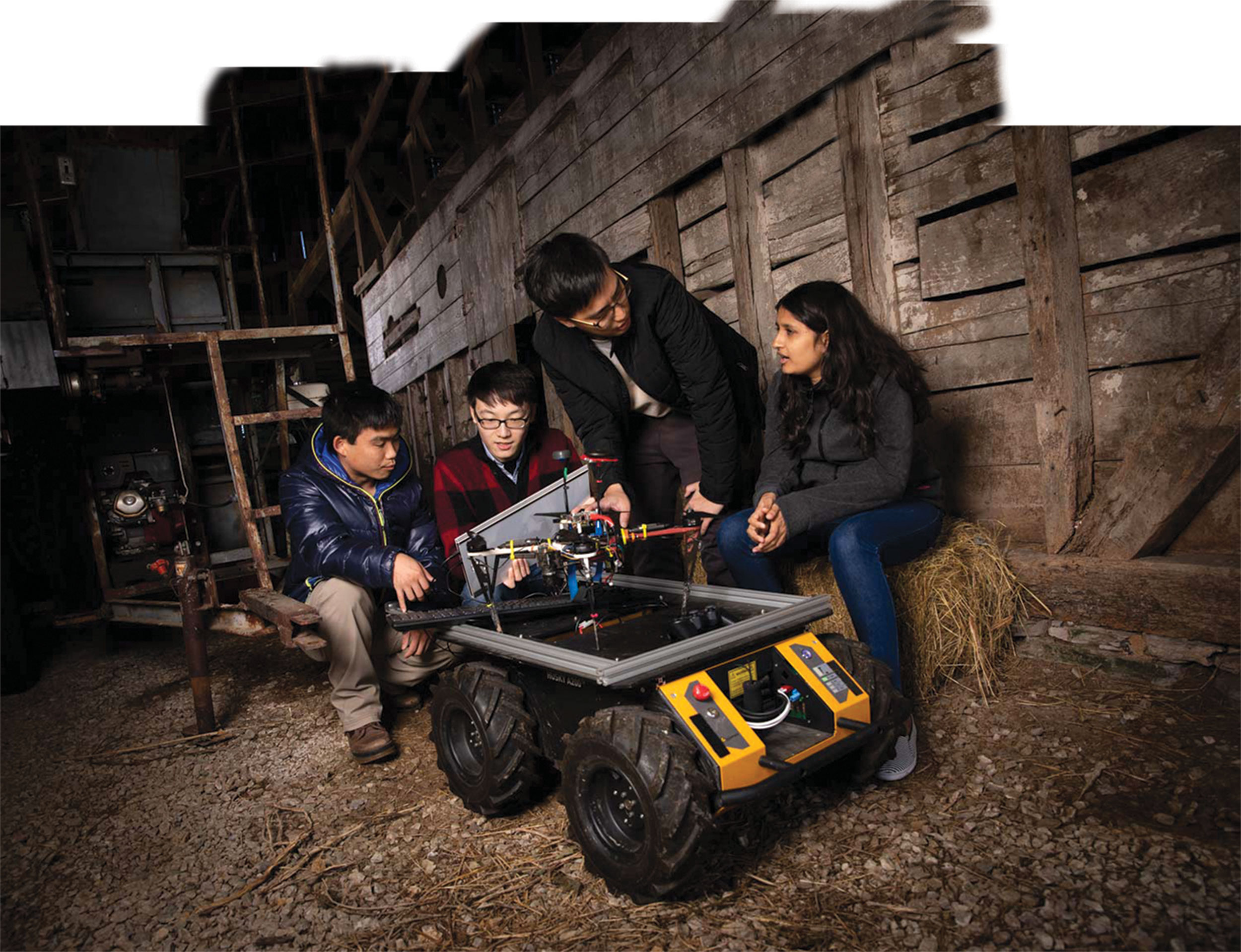 Kevin Yu and Yoonchang Sung work with Tianshu Xu and Deeksha Dixit on aerial and ground vehicles