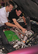 students work on electric car