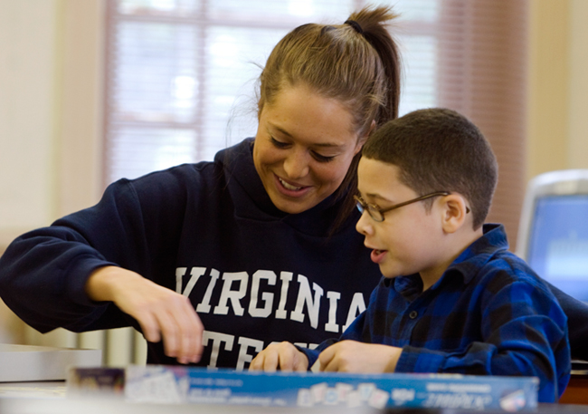 VT student working with elementary school student. Photo by Kim Peterson.