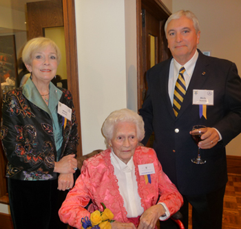 Kathleen Rollins, seated, widow of Forrest Rollins '36, the former faculty advisor to the Cotillion Club, poses with her hosts, Mary and Rick Monroe, at the reunion.