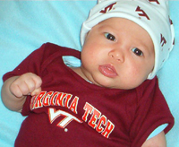 Rob Cole (ARCH '93) with his daughters and their distinctly Hokie creation.