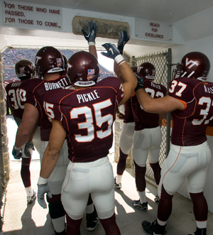 The last thing each football player does before entering Worsham Field is stroke a Hokie Stone embedded over the Lane Stadium doorway.