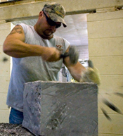 A local stonemason works with Hokie Stone.