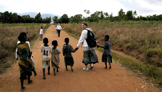 Becca FitzGerald '13 with children in Malawi