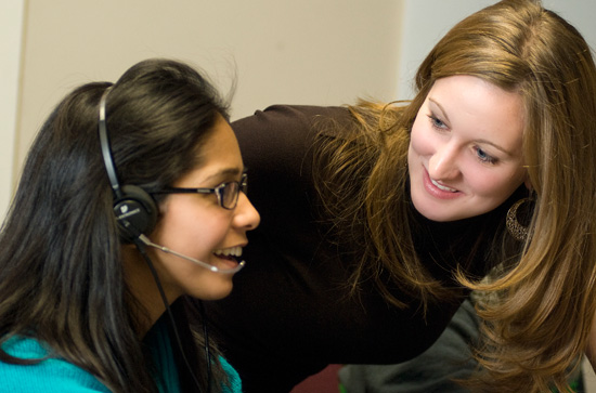 Shift manager Danielle Harris '11 (right) and caller Ishita Haque '11 