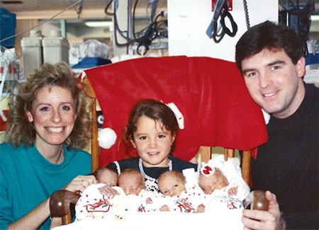 Lomakas with newborn quadruplets