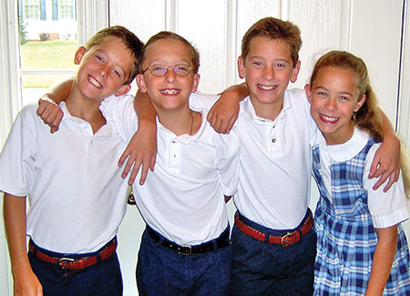 Lomaka quadruplets in school uniforms