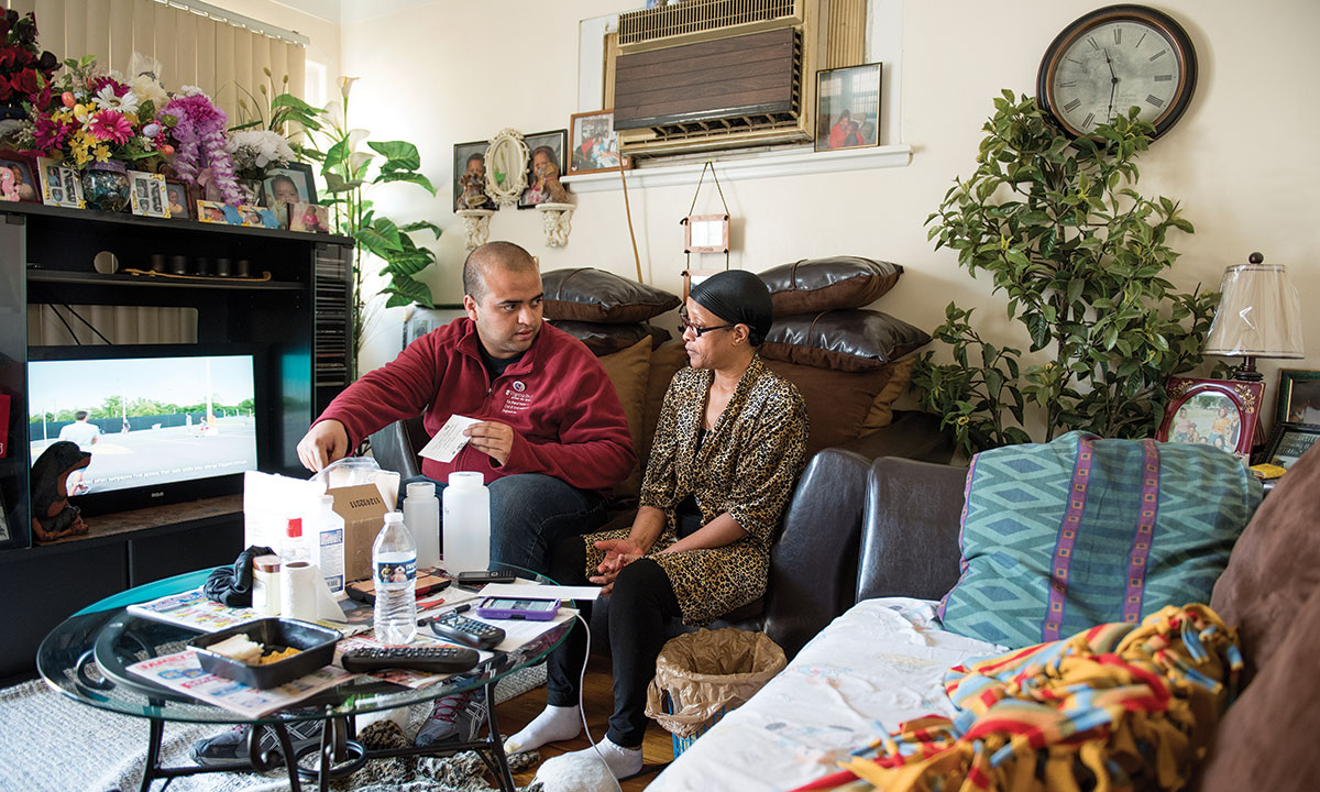 Virginia Tech doctoral student Anurag Mantha with a Flint resident