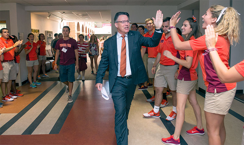 Virginia Tech President Tim Sands greeting students