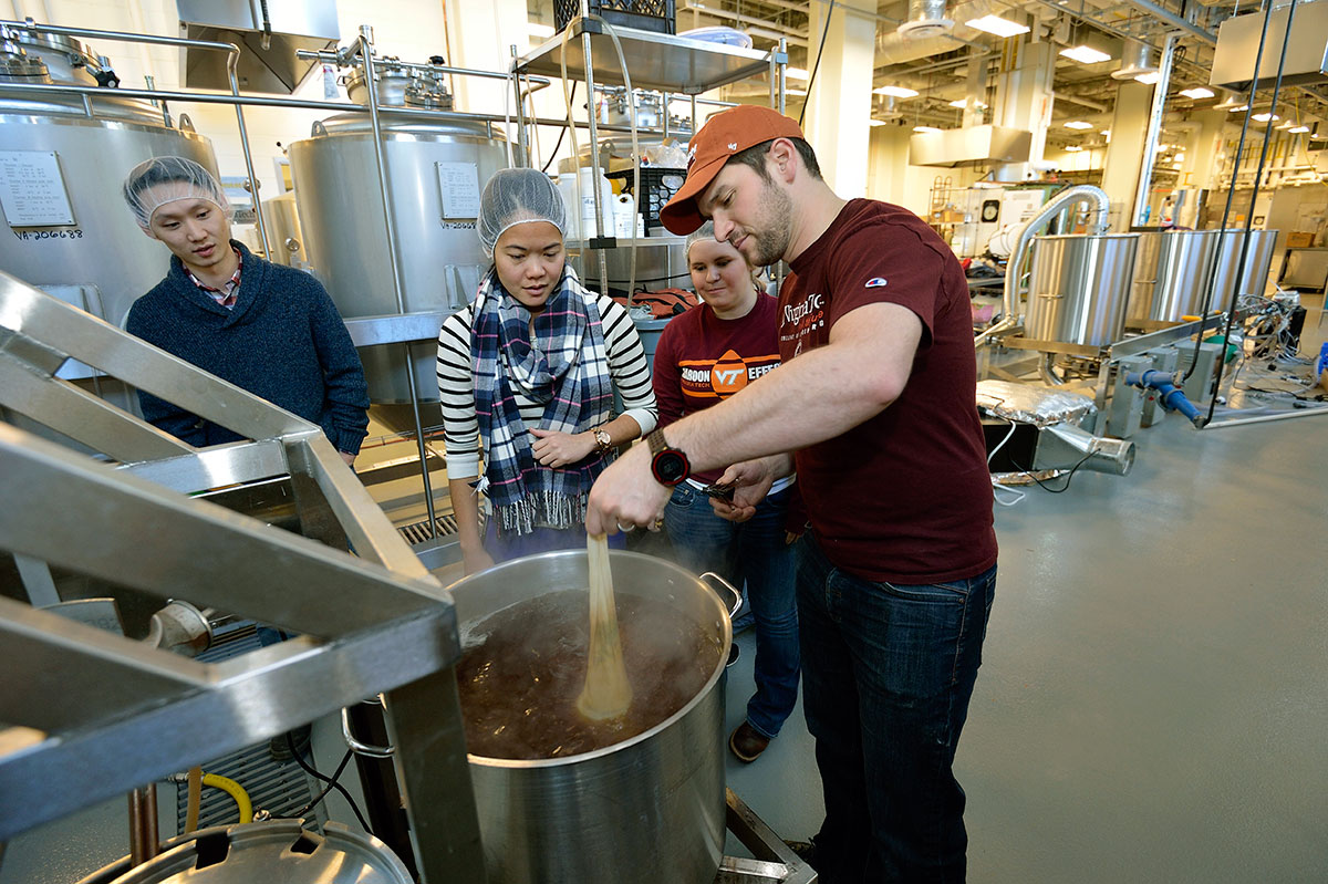 Virginia Tech students working in the brewhouse