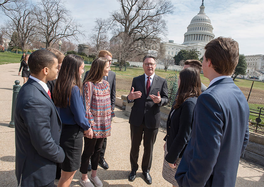 Virginia Tech President Tim Sands with students in Washington, D.C.