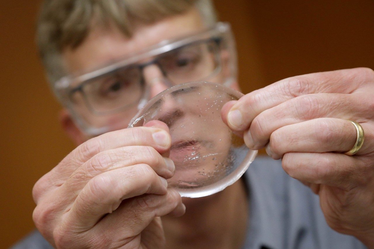 Tim Long examines a gel created in his lab
