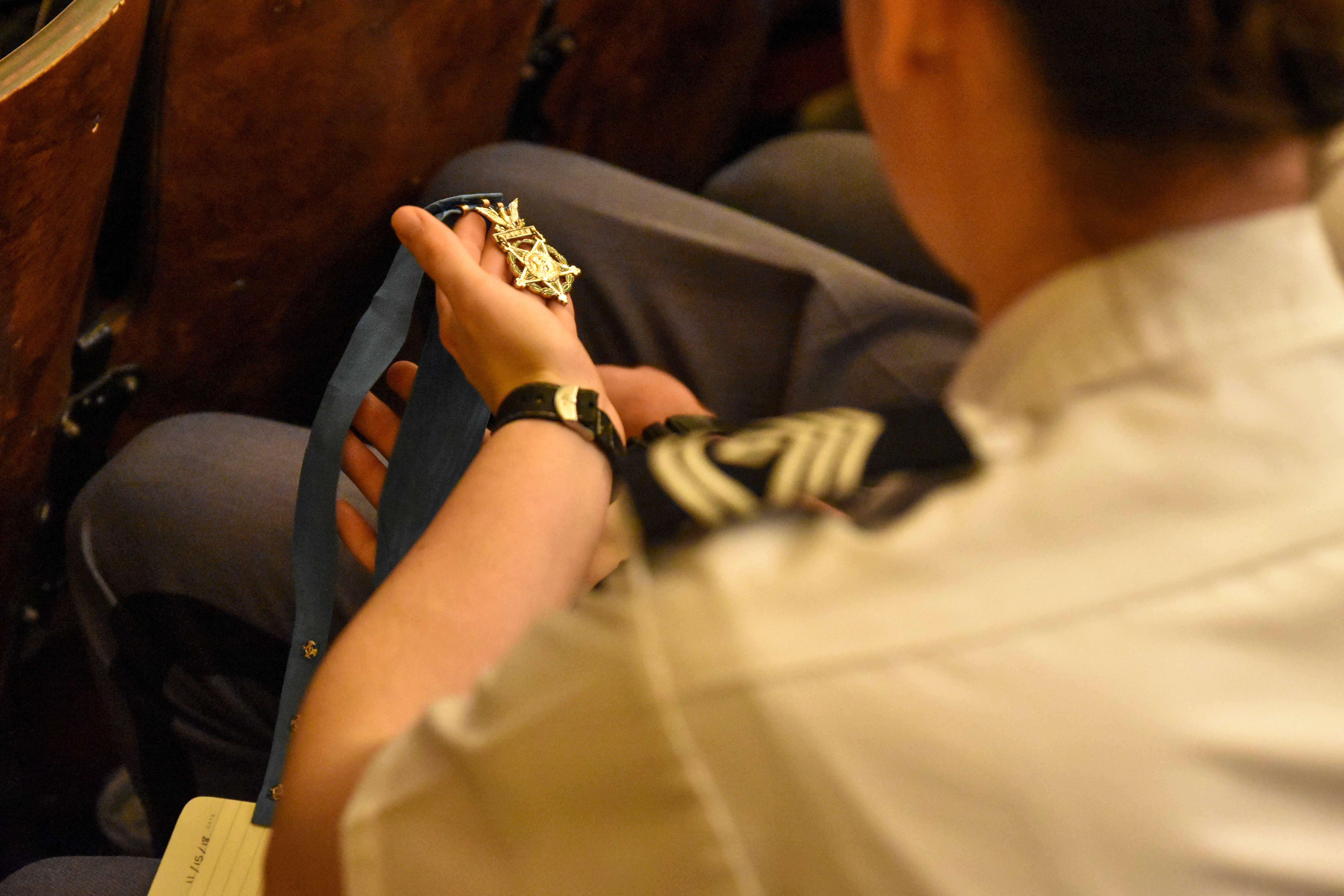 a cadet takes a close look at a Medal of Honor