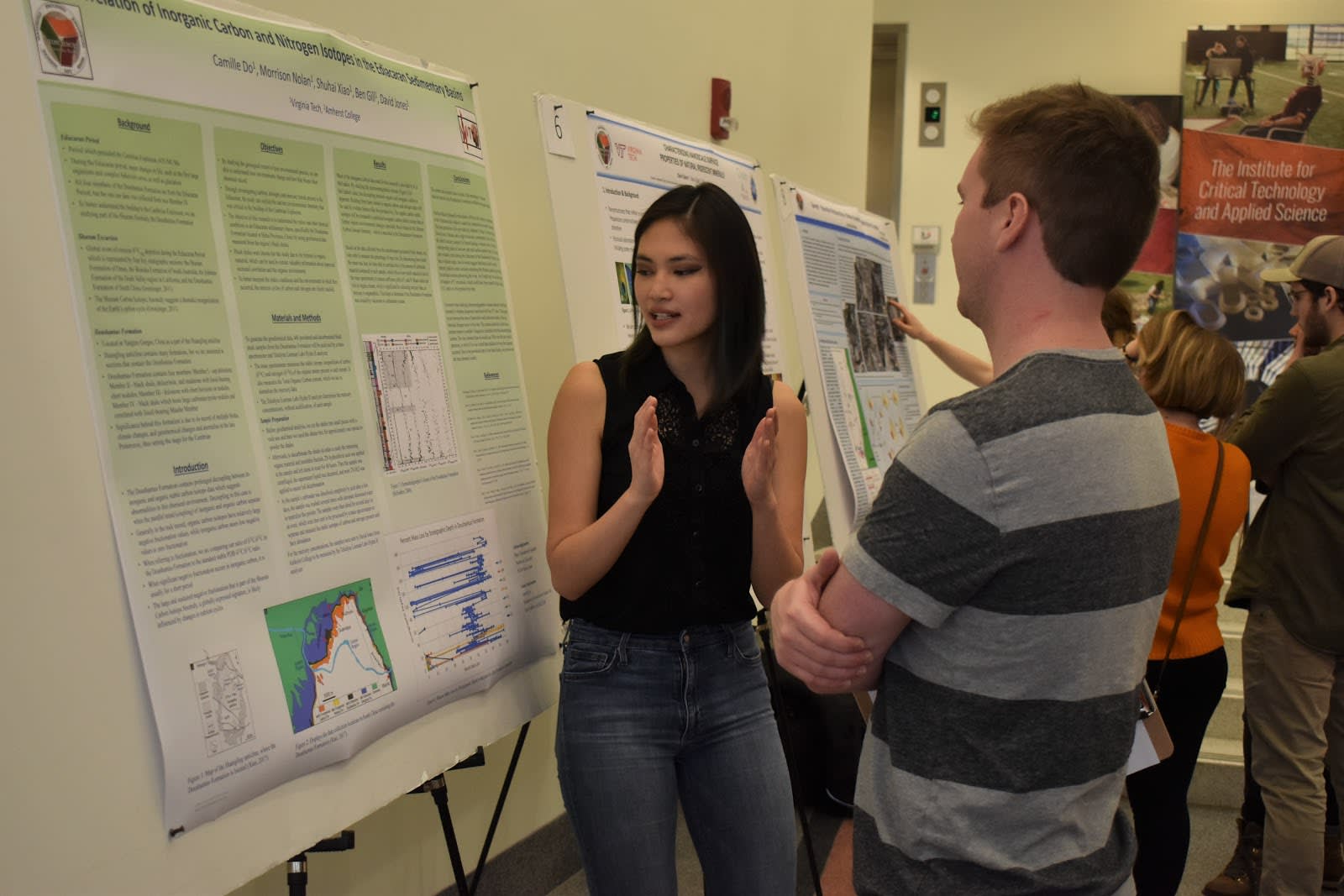 students in front of a poster session