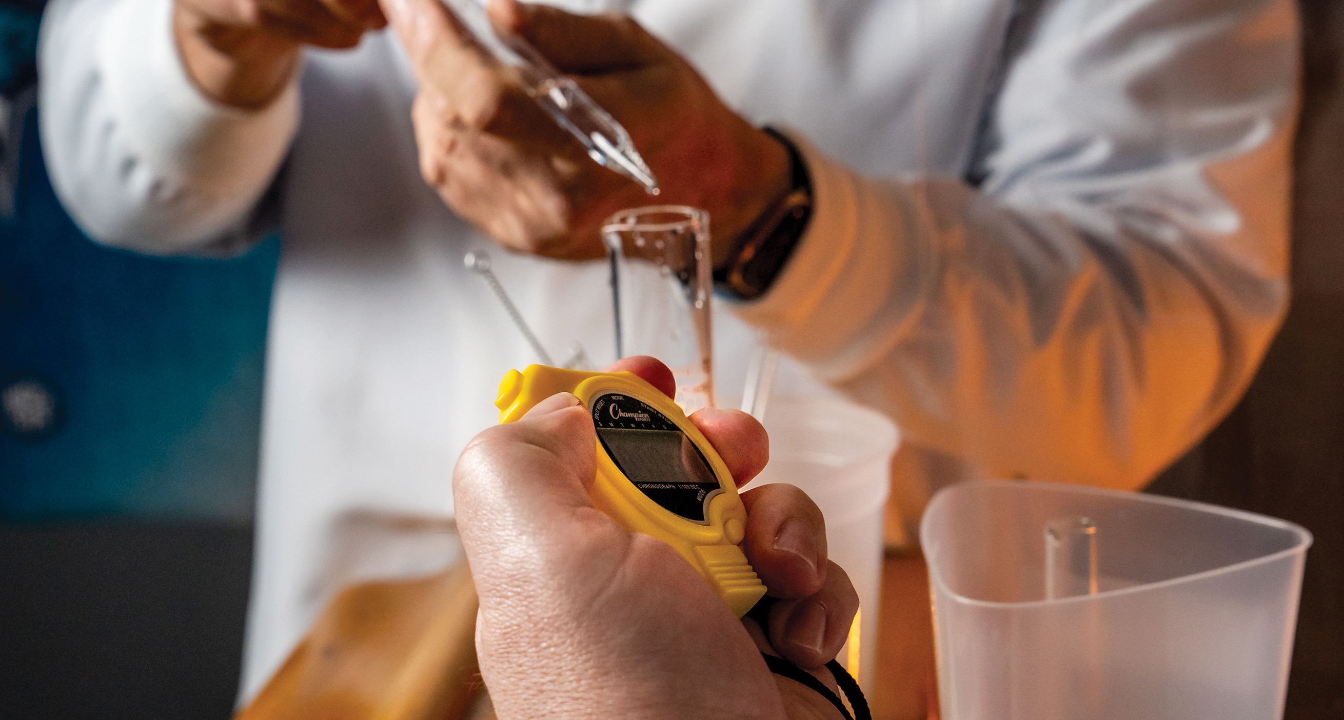 scientists with beakers