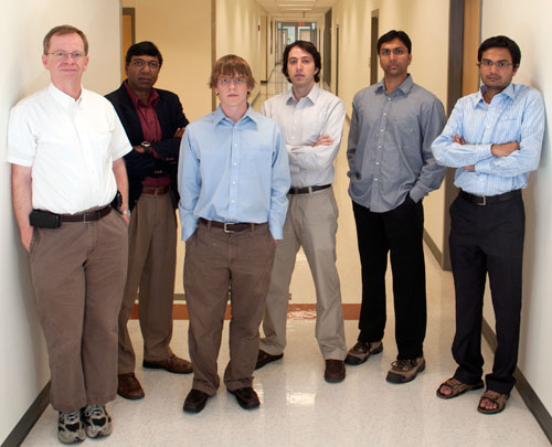 In the hallway ceiling above these wireless researchers, cognitive radios are at work. Researchers are, from left, Wireless@VT Director Jeff Reed and Associate Director Tamal Bose, Dan DePoy, Haris Volos, Dinesh Datla, and Barathram Ramkumar. Volos is a postdoctoral research associate; Ph.D. candidates DePoy, Datla, and Ramkumar are graduate research assistants. 