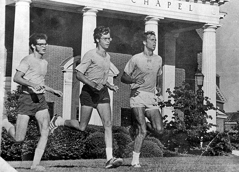 Thomas Gardner (right), running with college teammates