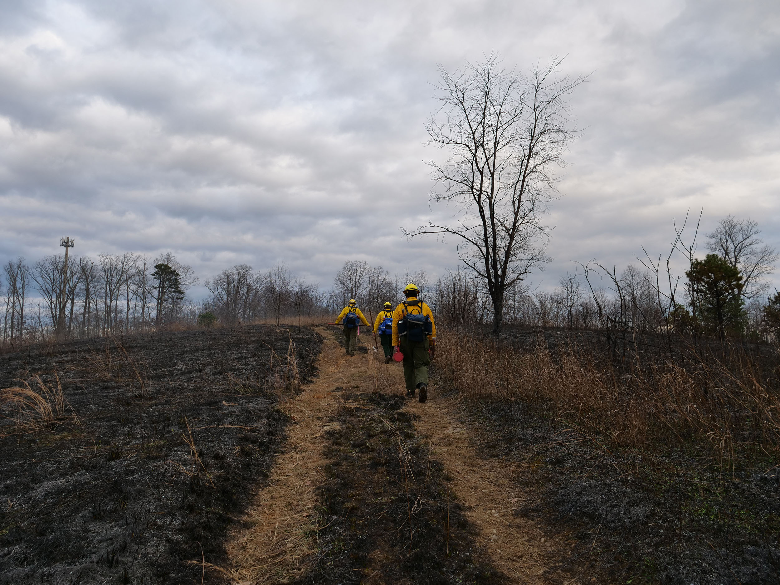 Crew members stay on site long after the burn is over to ensure that all flames are extinguished and no burning embers remain