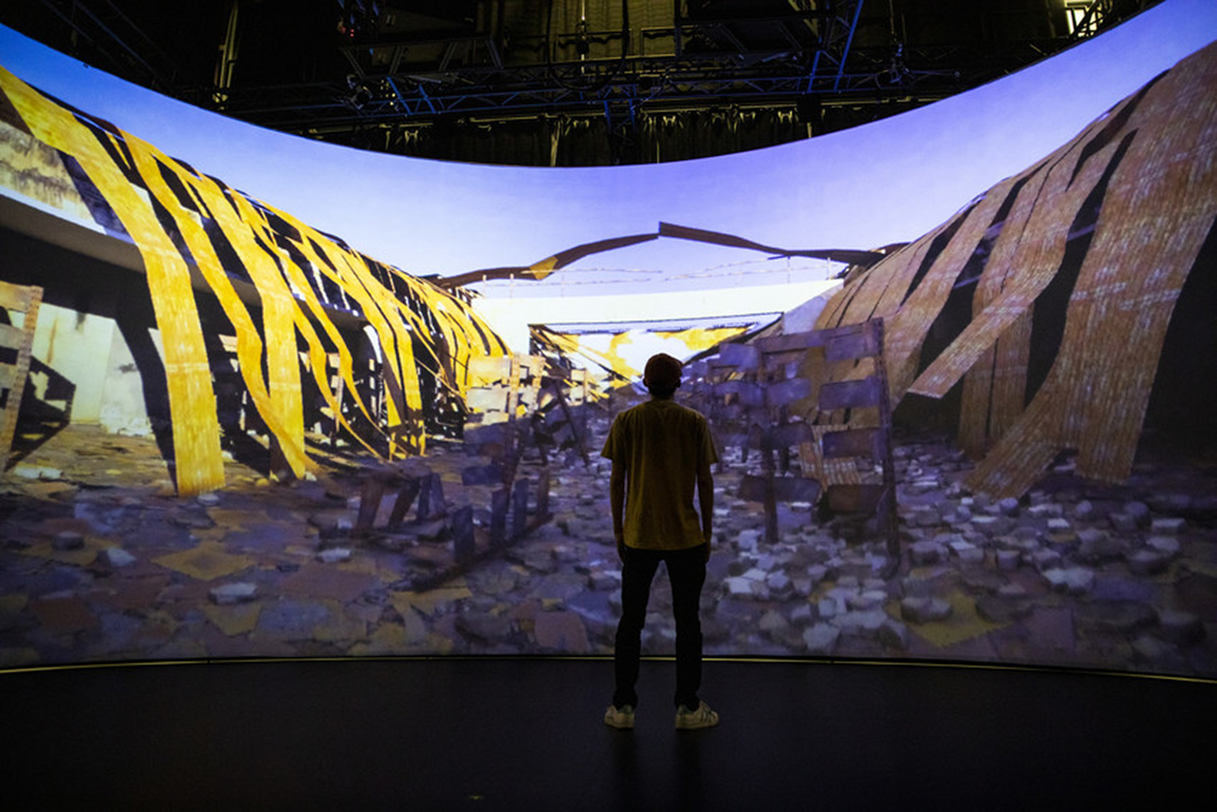 Xindi Liu works on finals touches to his project in the Cyclorama at the Cube