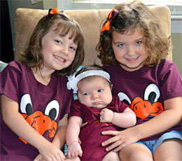 Adam L. Garland (ARCH '01) and Andrea Bobik Garland (ARCH '01), Mount Laurel, N.J., a daughter, Emily (center), born 6/28/12, and seated with sisters Julia (left) and Madison (right).